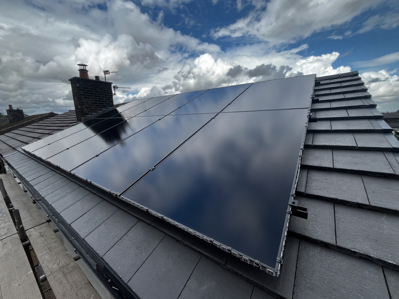 Solar panel roof installation at sunset